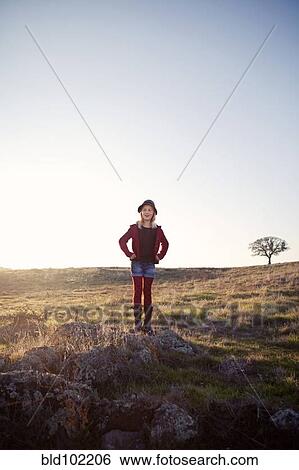 Stock Photograph - Caucasian girls standing in field. Fotosearch