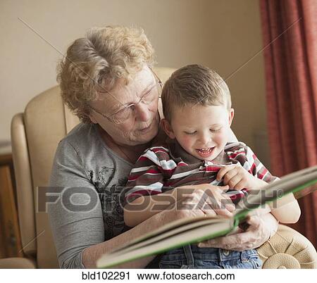 Caucasian grandmother reading book to grandson View Large Photo Image Stock Image - Caucasian grandmother reading book to grandson. Fotosearch