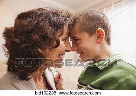 Stock Photo - Caucasian grandmother smiling at grandson. Fotosearch