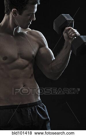 Caucasian man exercising with hand weights View Large Photo Image Stock Photo - Caucasian man exercising with hand weights. Fotosearch