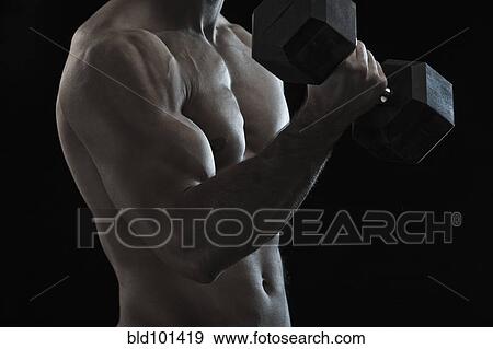 Caucasian man exercising with hand weights View Large Photo Image Stock Photo - Caucasian man exercising with hand weights. Fotosearch