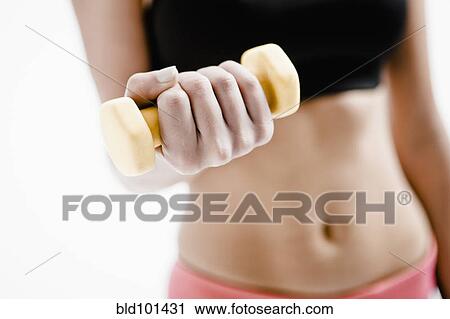 Caucasian woman exercising with hand weights View Large Photo Image Stock Image - Caucasian woman exercising with hand weights. Fotosearch