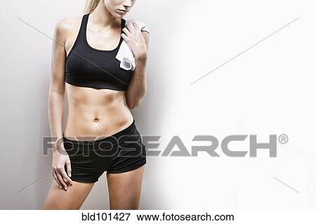 Stock Photo - Caucasian woman resting after exercise. Fotosearch