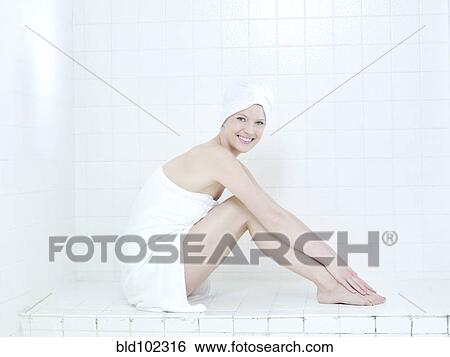 Caucasian woman wrapped in a towel View Large Photo Image Stock Photograph - Caucasian woman wrapped in a towel. Fotosearch