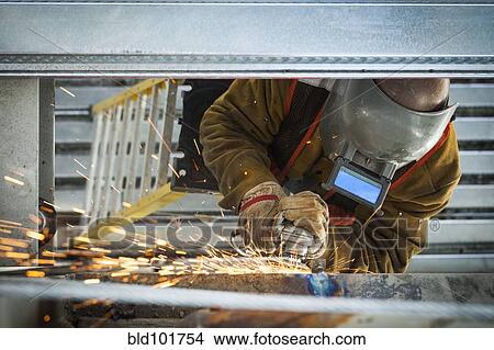 Construction worker grinding metal View Large Photo Image Picture - Construction worker grinding metal. Fotosearch
