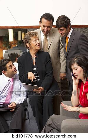 Hispanic business people in meeting together View Large Photo Image Stock Photo - Hispanic business people in meeting together. Fotosearch
