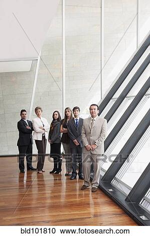 Hispanic business people standing together View Large Photo Image Stock Image - Hispanic business people standing together. Fotosearch