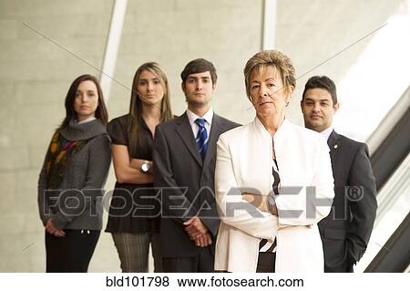 Hispanic business people standing together View Large Photo Image Stock Photo - Hispanic business people standing together. Fotosearch