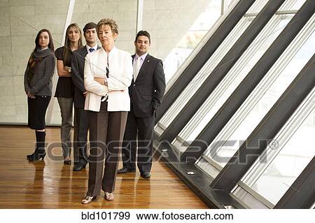 Stock Photo - Hispanic business people standing together. Fotosearch
