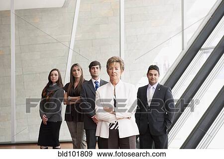 Stock Photo - Hispanic business people standing together. Fotosearch