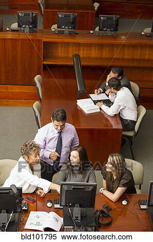 Stock Photography - Hispanic business people working together. Fotosearch