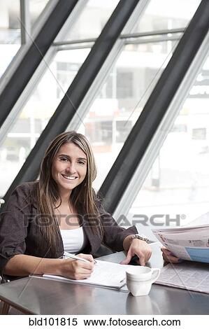 Hispanic businesswoman writing on notepad View Large Photo Image Stock Photography - Hispanic businesswoman writing on notepad. Fotosearch