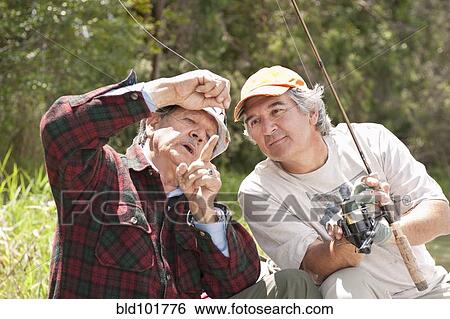 Hispanic men fishing View Large Photo Image Stock Photograph - Hispanic men fishing. Fotosearch