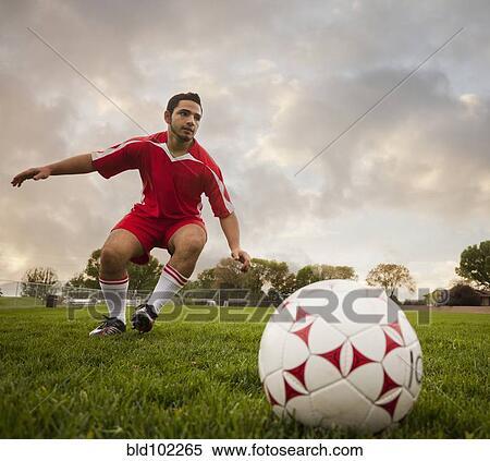 Hispanic soccer player about to kick the ball View Large Photo Image Stock Photography - Hispanic soccer player about to kick the ball. Fotosearch
