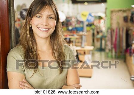 Hispanic woman standing in store View Large Photo Image Stock Photograph - Hispanic woman standing in store. Fotosearch