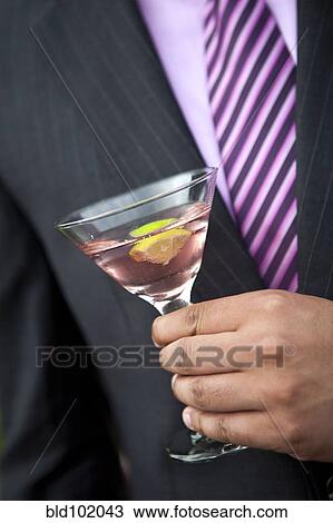 Man holding pink martini View Large Photo Image Stock Image - Man holding pink martini. Fotosearch