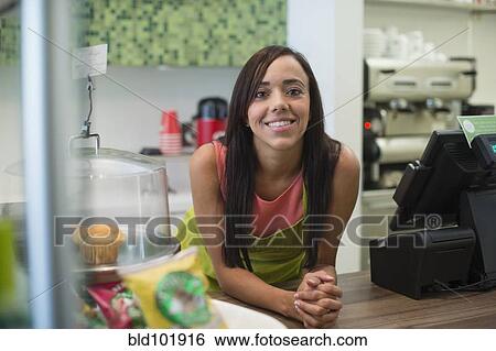 Mixed race business owner standing in shop View Large Photo Image Stock Photograph - Mixed race business owner standing in shop. Fotosearch