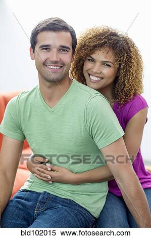 Mixed race couple hugging View Large Photo Image Stock Photography - Mixed race couple hugging. Fotosearch