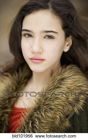 Stock Photograph - Serious Hispanic girl. Fotosearch