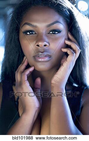 Stock Photo - Serious woman with head in hands. Fotosearch