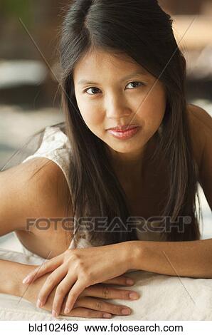 Stock Photo - Smiling Asian woman. Fotosearch