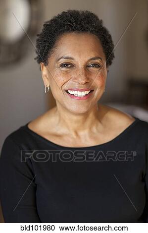 Stock Image - Smiling Black woman. Fotosearch