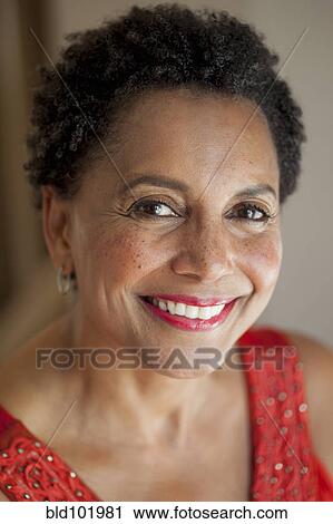 Stock Image - Smiling Black woman. Fotosearch