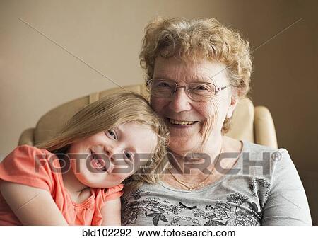 Stock Image - Smiling Caucasian grandmother and granddaughter. Fotosearch
