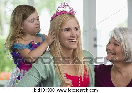 Smiling Caucasian grandmother, mother and daughter View Large Photo Image Stock Image - Smiling Caucasian grandmother, mother and daughter. Fotosearch