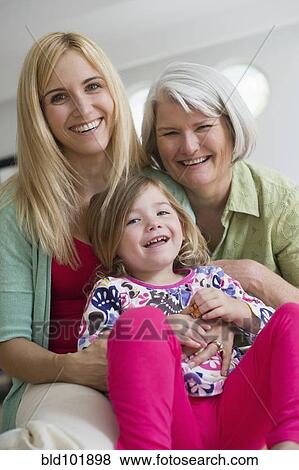 Smiling Caucasian grandmother, mother and daughter View Large Photo Image Stock Photo - Smiling Caucasian grandmother, mother and daughter. Fotosearch