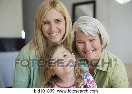 Stock Photo - Smiling Caucasian grandmother, mother and daughter. Fotosearch
