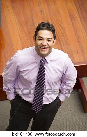 Smiling Hispanic businessman View Large Photo Image Stock Photograph - Smiling Hispanic businessman. Fotosearch