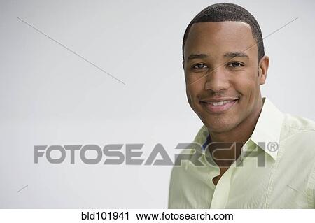 Stock Image - Smiling mixed race man. Fotosearch