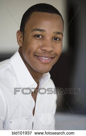 Stock Photo - Smiling mixed race man. Fotosearch