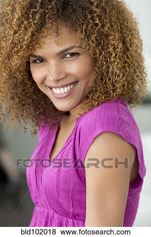 Stock Photo - Smiling mixed race woman. Fotosearch