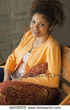 Stock Photo - Smiling mixed race woman. Fotosearch