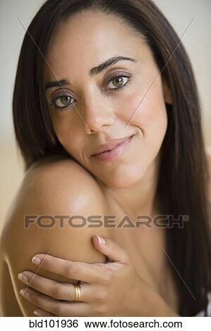 Stock Photograph - Smiling mixed race woman. Fotosearch