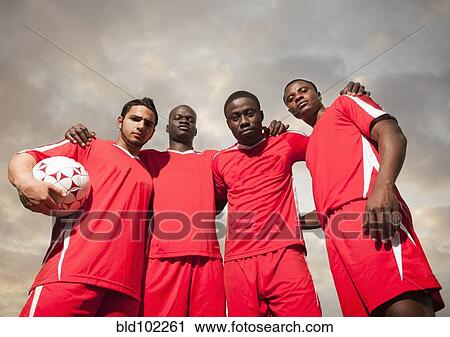 Soccer players standing together View Large Photo Image Stock Image - Soccer players standing together. Fotosearch