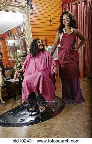 Stock Image - Woman having hair done in beauty salon. Fotosearch
