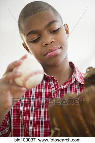 African American boy holding baseball View Large Photo Image Stock Photo - African American boy holding baseball. Fotosearch