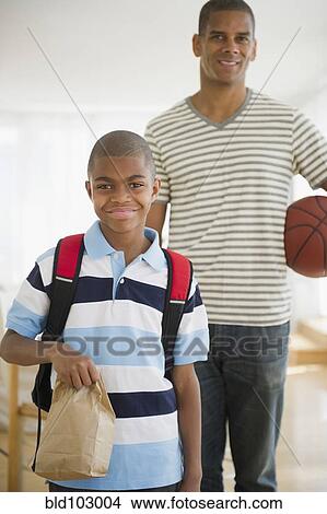 African American boy holding lunch sack View Large Photo Image Picture - African American boy holding lunch sack. Fotosearch