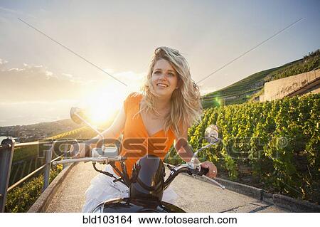 Caucasian girl riding scooter in vineyard View Large Photo Image Picture - Caucasian girl riding scooter in vineyard. Fotosearch