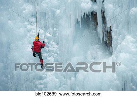 Caucasian man climbing ice wall View Large Photo Image Stock Photo - Caucasian man climbing ice wall. Fotosearch