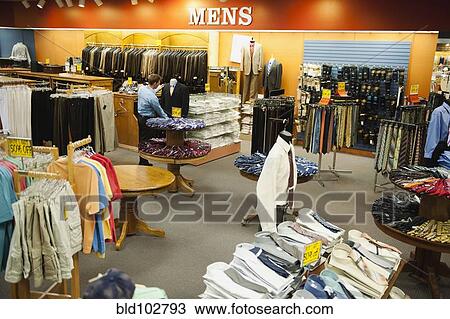 Caucasian man working in men's clothing store View Large Photo Image Stock Image - Caucasian man working in men's clothing store. Fotosearch