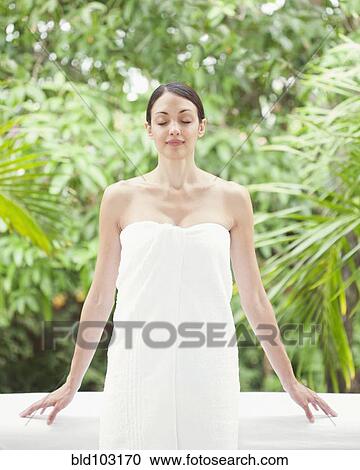 Caucasian woman in spa wrapped in a towel View Large Photo Image Stock Image - Caucasian woman in spa wrapped in a towel. Fotosearch