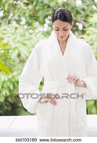Caucasian woman tying bathrobe View Large Photo Image Stock Photo - Caucasian woman tying bathrobe. Fotosearch