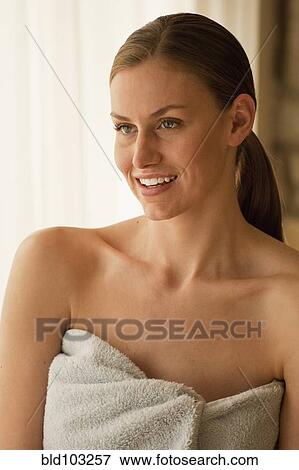 Stock Photo - Caucasian woman wrapped in a towel. Fotosearch