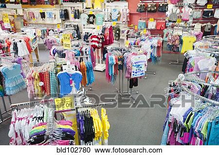 Children's clothing on racks in store View Large Photo Image Stock Image - Children's clothing on racks in store. Fotosearch