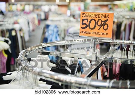 Clearance sale tag in clothing store View Large Photo Image Stock Photograph - Clearance sale tag in clothing store. Fotosearch