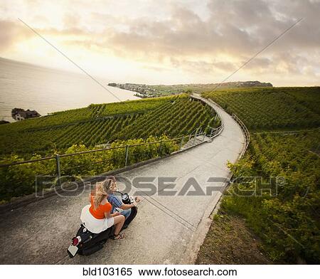 Couple riding scooter in vineyard View Large Photo Image Stock Photography - Couple riding scooter in vineyard. Fotosearch
